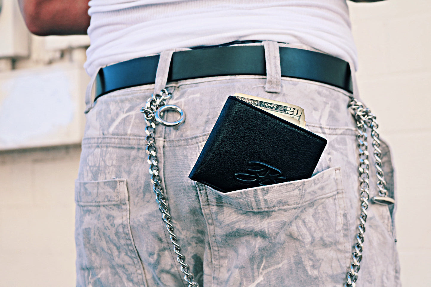 Pistol Black wallet in denim pants with a wallet chain