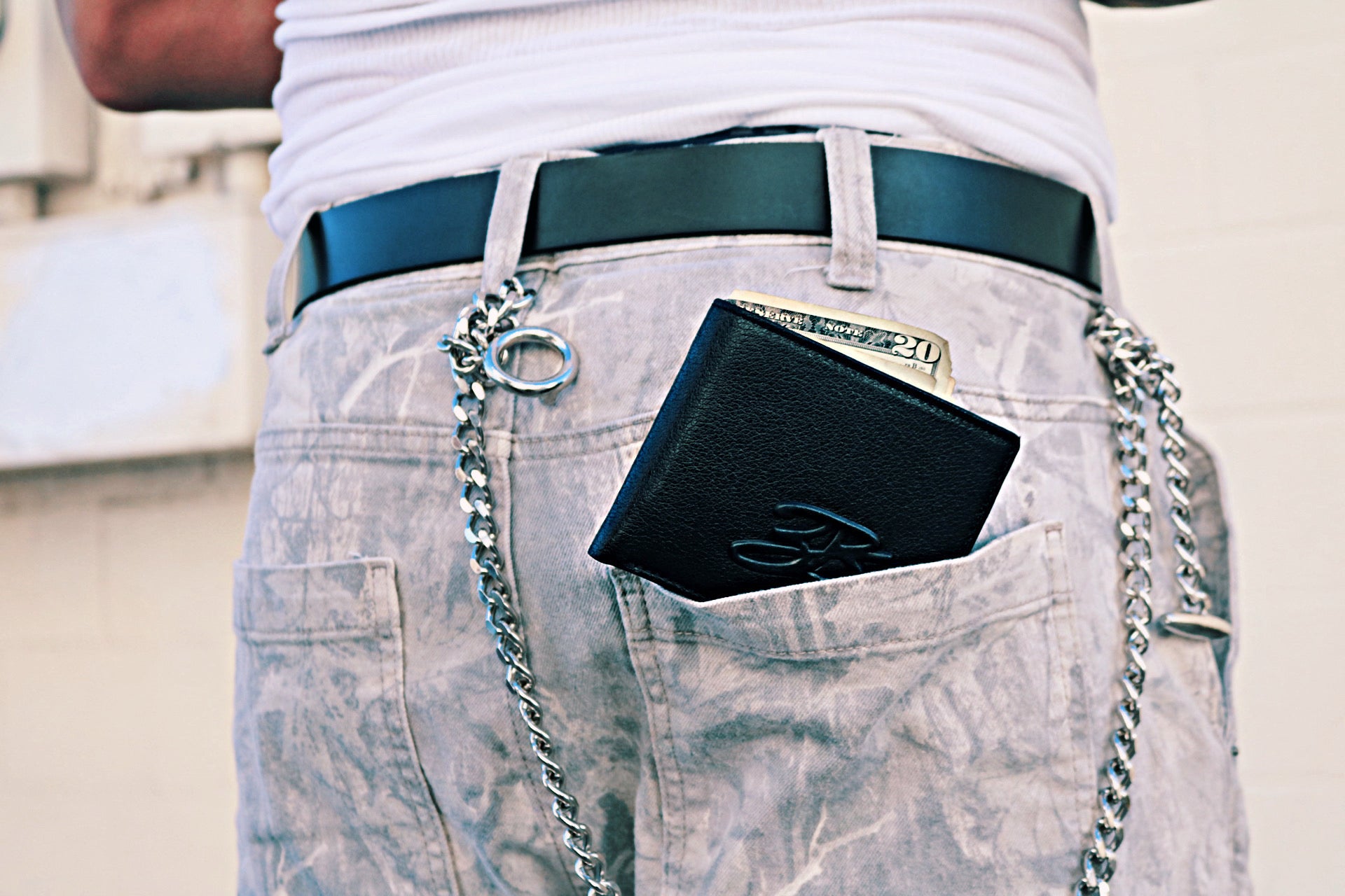 Pistol Black wallet in denim pants with a wallet chain